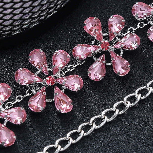Trendy rhinestone clavicle chain necklace for women featuring pink flower-shaped pendants and a silver-plated design.