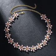 Trendy pink rhinestone clavicle chain necklace with gold plating, featuring flower-shaped pendants for women.
