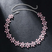Rhinestone clavicle chain necklace with pink flower pendant, trendy women's accessory in silver plating.